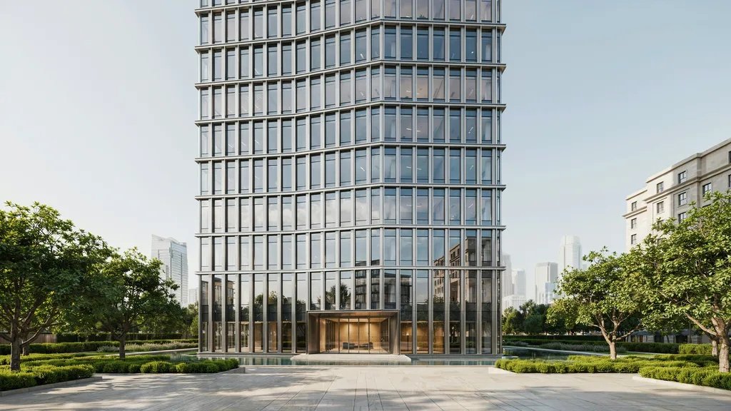 Modern high-rise with a unitized curtain wall system and reflective glass facade.