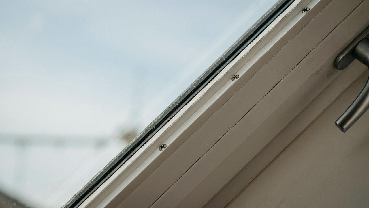  Glass panel fitted securely inside a window frame.