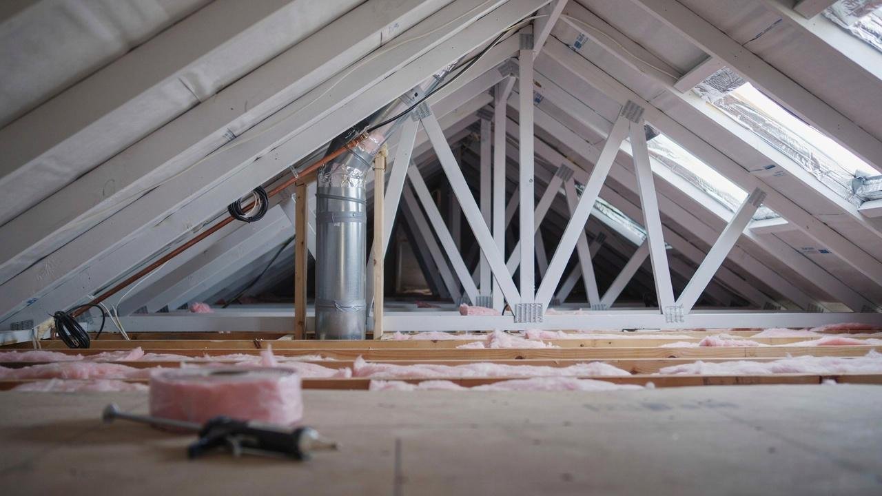 Attic inspection and preparation after insulation removal.
