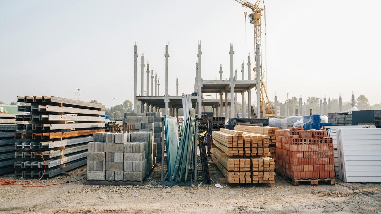 Steel, concrete, wood, brick, glass, and vinyl materials used in different construction projects.