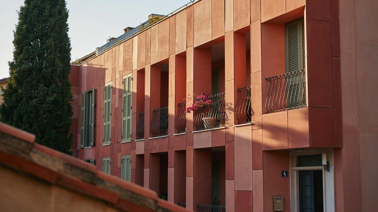 Terracotta cladding with warm natural tones on building exterior.
