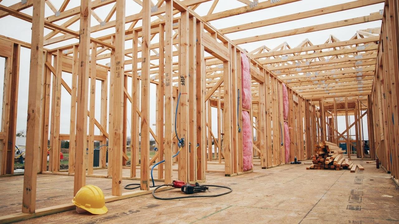 Wood framing structure behind exterior siding.