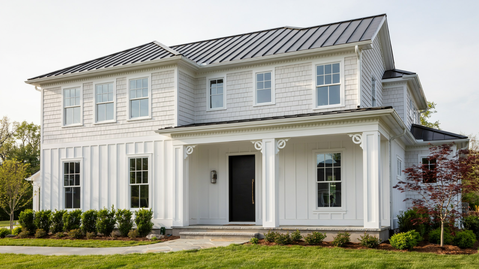 Exterior millwork showing porch columns, fascia boards, decorative brackets, and window trim enhancing the home's architectural appearance and protection.