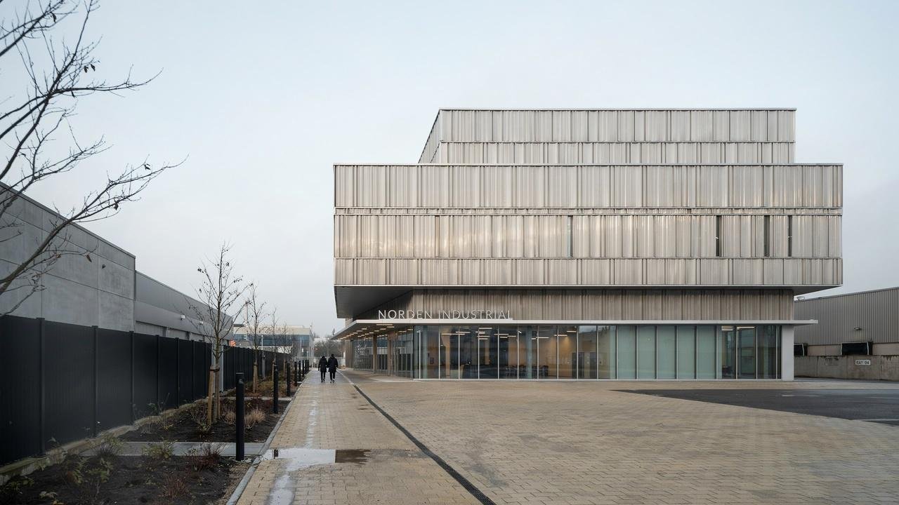 Metal cladding on a modern industrial building.