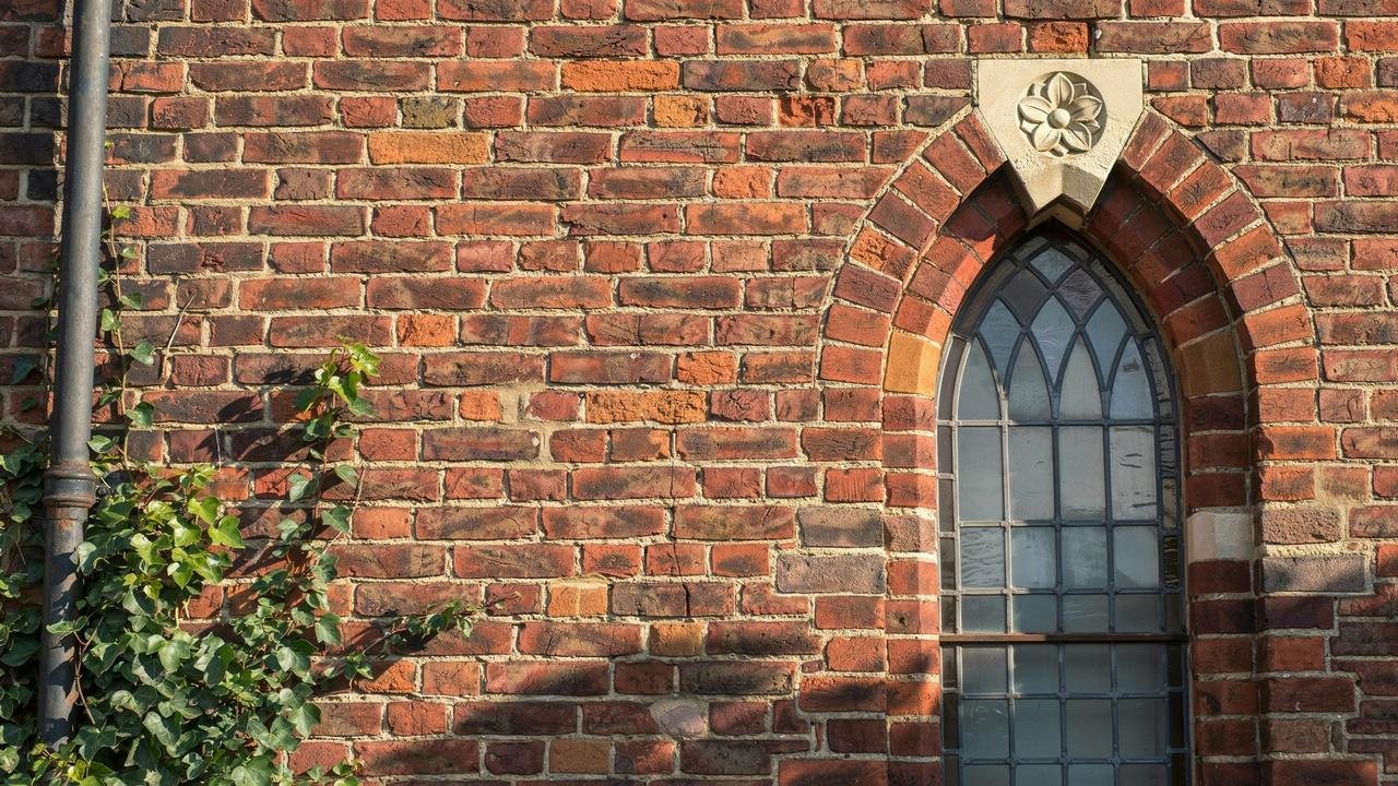 Brick cladding on a traditional building exterior.
