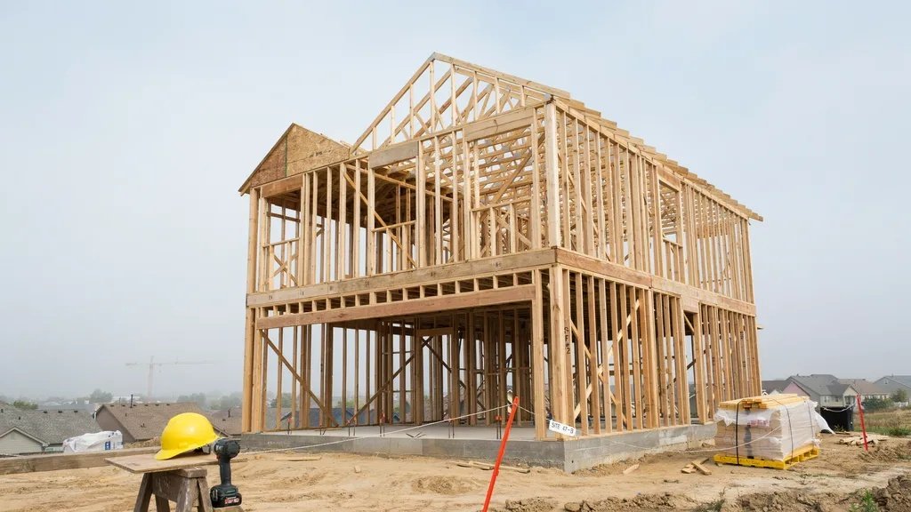 Framing stage where the structure of a custom home begins to take shape.