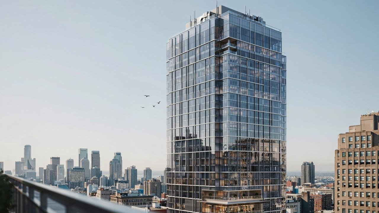 High-rise building featuring a glass curtain wall facade system.