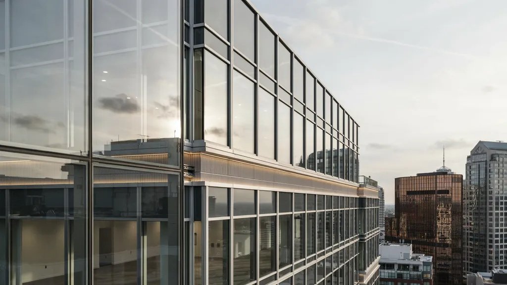 Modern glass curtain wall system with aluminum framing on a high-rise façade.