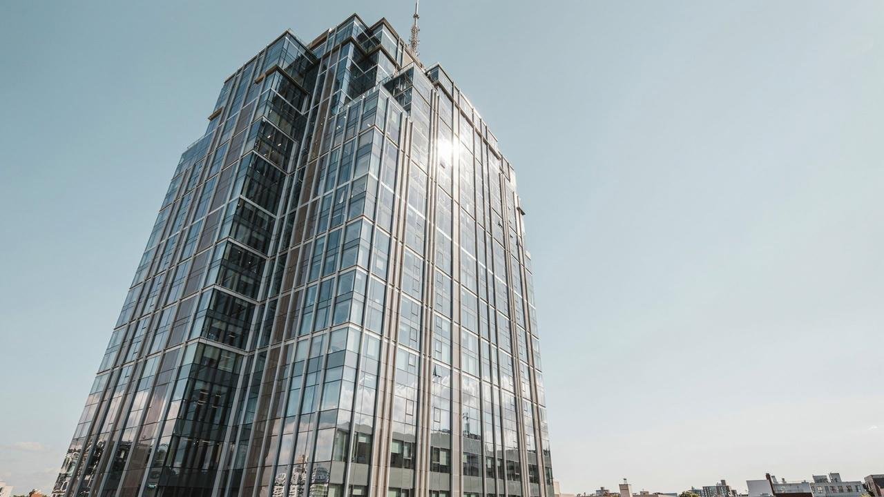 Tinted and reflective glass reducing heat and glare.