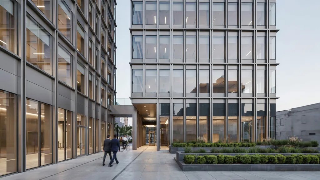 Modern building exterior with glazed curtain wall glass facade design.