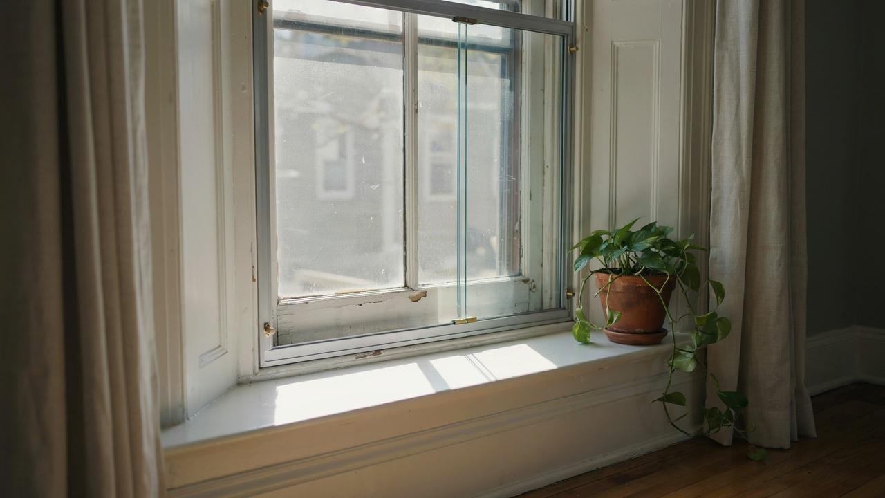 Secondary glazing added inside an existing window for insulation.