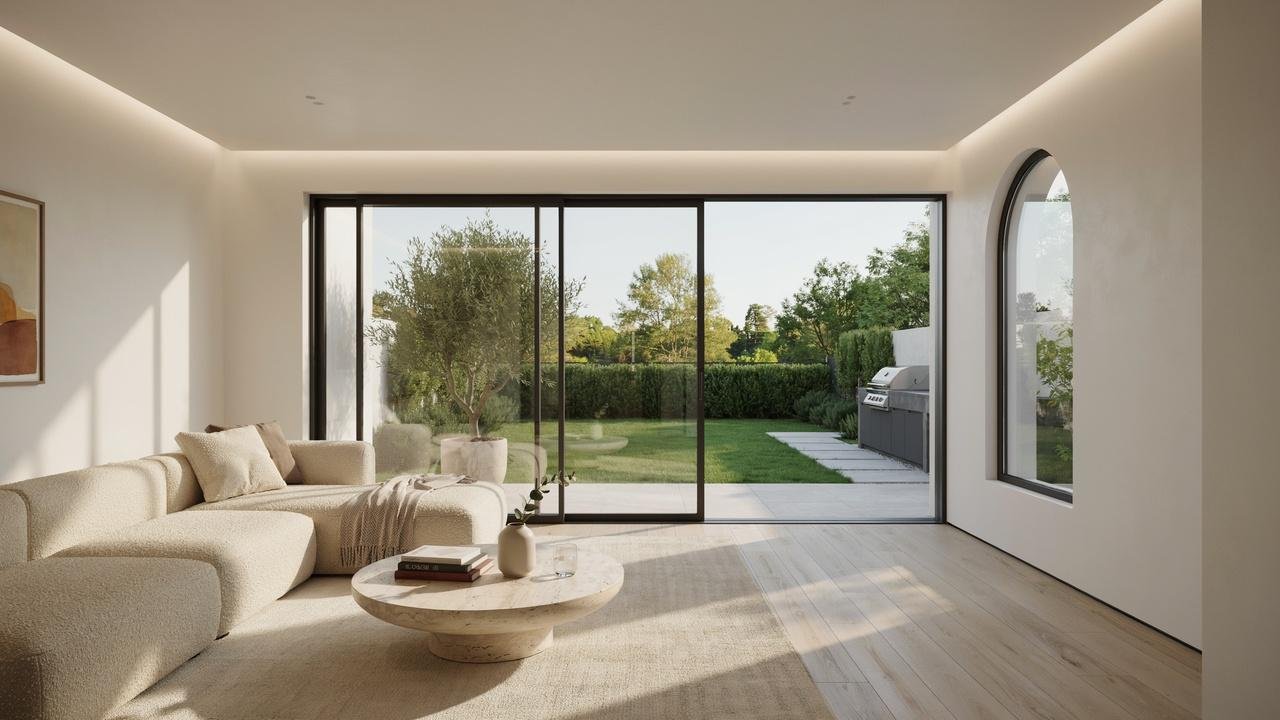 Modern sliding glass door connecting a living room to an outdoor patio.